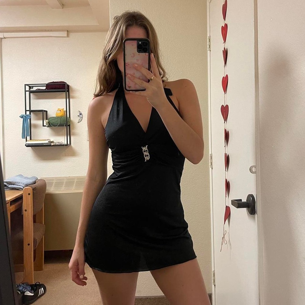 the vintage black halter mini dress with silver belt detailing